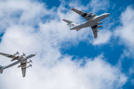 Moscow, Russia - May, 05, 2021: The group of strategic bomber of long-range aviation Tu-95ms and flying tanker Il-78m fly over the Red Squareのeditorial素材