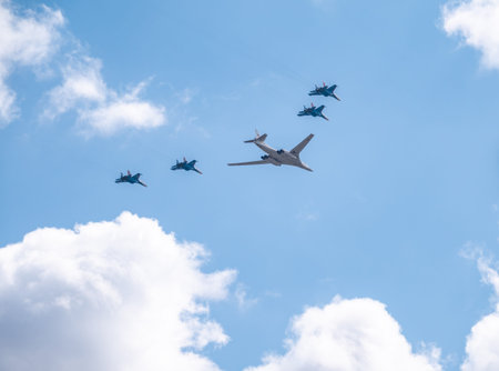 Moscow, Russia - May, 05, 2021: The Tu-160 strategic missile carrier, accompanied by four Su-35S...