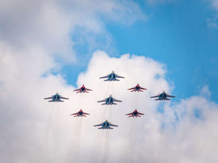 Moscow, Russia - May, 05, 2021: Diamond-shape of 4 Mig-29 The Russian Knights and 5 Su-27 Swifts in the sky over Red Square in the group Cuban Diamond. Aviation part of Victory parade in Moscowのeditorial素材