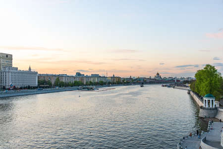 Cruise ship sails on the Moscow river in Moscow city center, popular place for walking. Panoramic view of Moscow river with cruise boatの写真素材