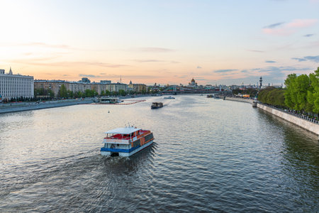 Cruise ship sails on the Moscow river in Moscow city center, popular place for walking. Panoramic view of Moscow river with cruise boatの写真素材