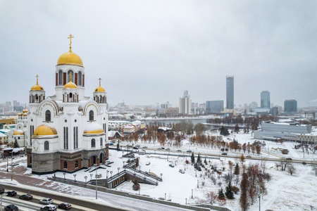 Panorama of winter Yekaterinburg and Temple on Blood in the first snowfall. At the temple are written the lines of ancient prayers in the Old Slavonic language. Aerial view. Yekaterinburg, Russiaの写真素材