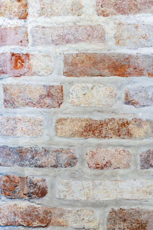 Fragment of an ancient medieval brick wall. Vintage bricks. Old wall.の写真素材