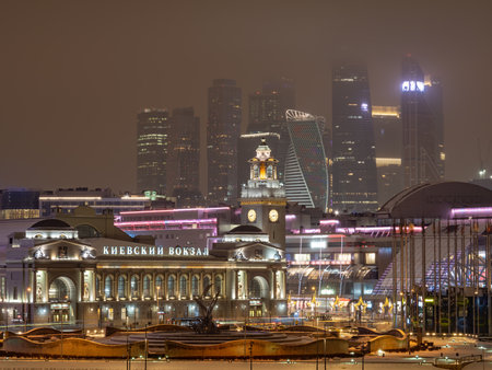 Panoramic view from the embankment of the Moskva River to Kievsky railway station and Moscow city at nightの写真素材