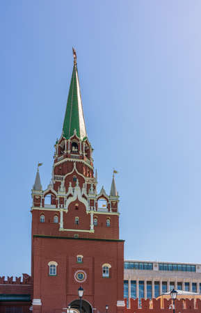 Troitskaya tower of Moscow Kremlin on a blue sky background in sunny summer day. The Trinity or Troitskaya Towerの写真素材