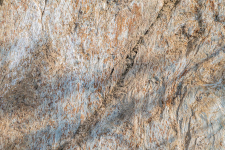 Detail of stone texture for background. Surface of the marble with brown tint. Sandstone background