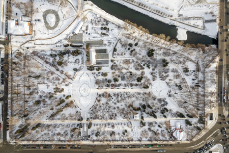 Small park with bare trees covered with snow. Aerial view of residential area in winter. Aerial view to winter park in Yekaterinburgの写真素材