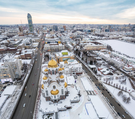Winter Yekaterinburg and Temple on Blood in beautiful cloudy sunset. aerial view. Yekaterinburg, Russia. Translation of the text on the facade of the temple: Honest to the Lord is death of His saints.の写真素材
