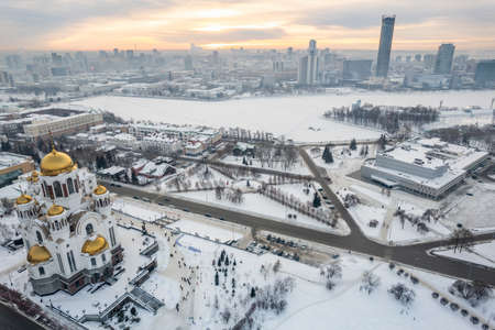 Winter Yekaterinburg and Temple on Blood in beautiful cloudy sunset. aerial view. Yekaterinburg, Russia. Translation of the text on the facade of the temple: Honest to the Lord is death of His saints.の写真素材