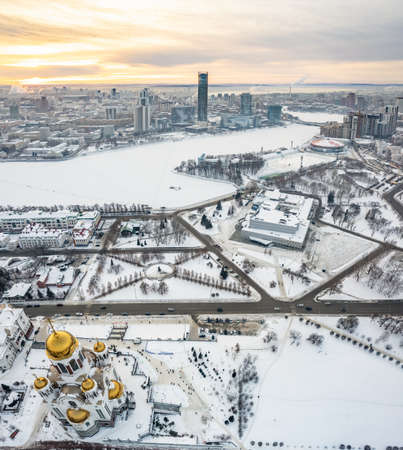Winter Yekaterinburg and Temple on Blood in beautiful cloudy sunset. aerial view. Yekaterinburg, Russia. Translation of the text on the facade of the temple: Honest to the Lord is death of His saints.の写真素材