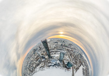 Aerial winter city view with crossroads and roads, houses, buildings, parks and bridges. Copter shot. Little planet sphere mode. Spherical panorama of the city, little planet. Yekaterinburg, Russia.の写真素材