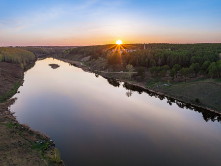 Beauriful sunset view along the Iset river and rocks near Kamensk-Uralskiy. A scenic sunset at the...