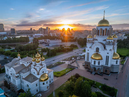 Summer Yekaterinburg, Temple on Blood and Church of St. Nicholas in cloudy sunset. Aerial view of Yekaterinburg, Russia. Translation of text on the temple: Honest to the Lord is the death of His saintsの写真素材