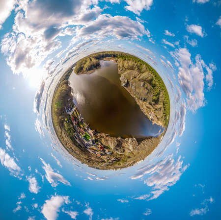 Confluence of the Iset and Kamenka rivers in the city Kamensk-Uralskiy. Iset and Kamenka rivers, Kamensk-Uralskiy, Sverdlovsk region, Ural mountains, Russia. aerial view. Little planet sphere mode.の写真素材