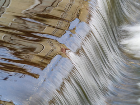 A small flat cascade in a calm river. Water backgroundの写真素材