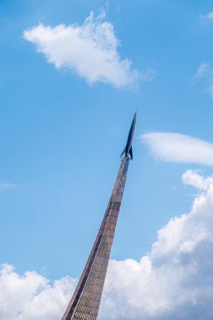 Monument to the Conquerors of Space, Moscow, Russia. Rocket monument of Russian cosmonautics, Soviet space conquerors, space industry engineers on VDNKH. Rocket in the sky. metal rocket stela pillarのeditorial素材