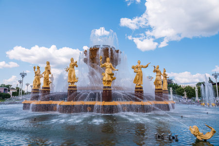 Moscow, Russia - July 17, 2022: The Peoples Friendship Fountain in VDNKh park in Moscow. Amazing sunny view of the Soviet architecture, landmark of Moscow. Beautiful luxurious old fountain in summer. famous tourist placeのeditorial素材