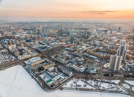 Embankment of central pond and Plotinka in Yekaterinburg at winter sunset. Winter snow-covered city. The historic center of the Yekaterinburg, Russia, Aerial Viewの写真素材
