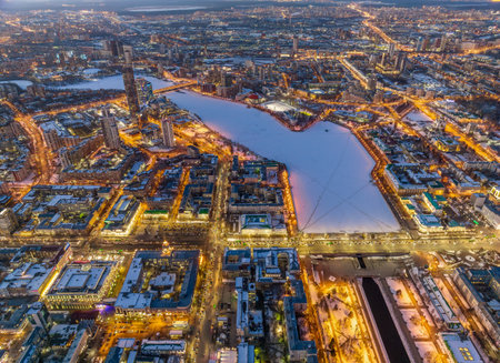 Embankment of central pond and Plotinka in Yekaterinburg at winter sunset. Winter snow-covered city. The historic center of the Yekaterinburg, Russia, Aerial Viewの写真素材