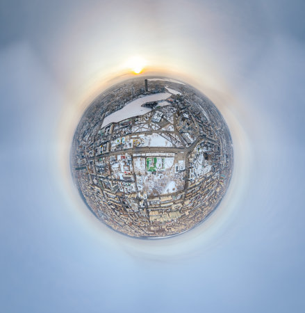 Aerial winter city view with crossroads and roads, houses, buildings, parks and bridges. Copter shot. Little planet sphere mode. Spherical panorama of the city, little planet. Yekaterinburg, Russia.の写真素材