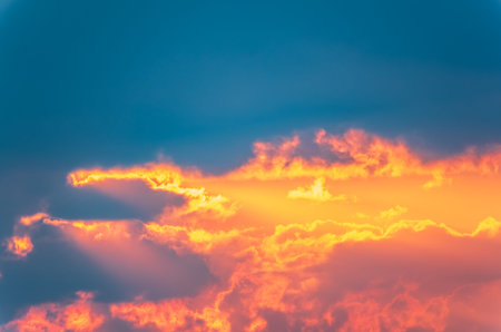 Dramatic cloudy sky background. Orange cloudy sunset sky. Natural photo background