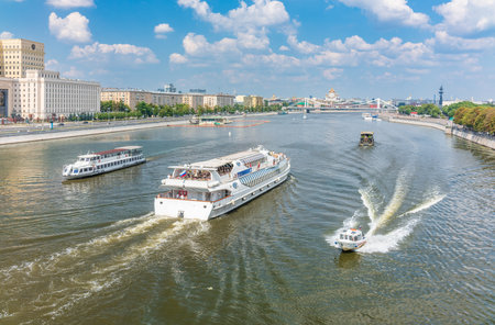 Moscow, Russia - August 4, 2022: Cruise ship sails on the Moscow river in Moscow city center, popular place for walking. Panoramic view of Moscow river with cruise boatのeditorial素材