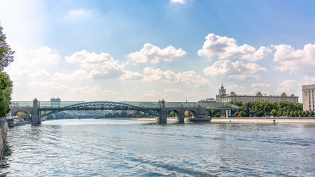 View of the Moscow river embakment, Pushkinsky bridge and cruise ships at sunset. Wide Moskva River, Pushkinsky bridge, Groky Park, Frunzenskaya embankment,の写真素材