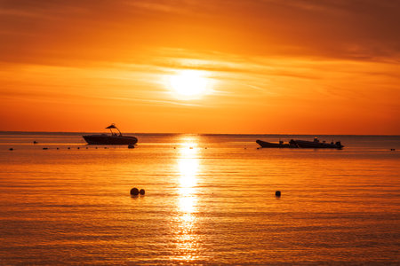 Beautiful red and orange sunrise over the sea. Beautiful seascape scenery, Amazing light of nature sunset backgroundの写真素材