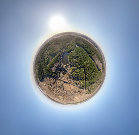 Spring or autumn lake in forest. Aerial view of lake in spring or autumn. Spring sunset landscape. Little planet sphere modeの写真素材