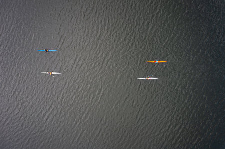 Kayaking top view. Group of kayaks rowing. Kayaks float on the river, view from above. Aerial view from drone.の写真素材