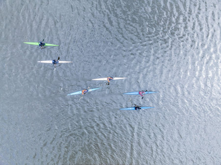 Kayaking top view. Group of kayaks rowing. Kayaks float on the river, view from above. Aerial view...