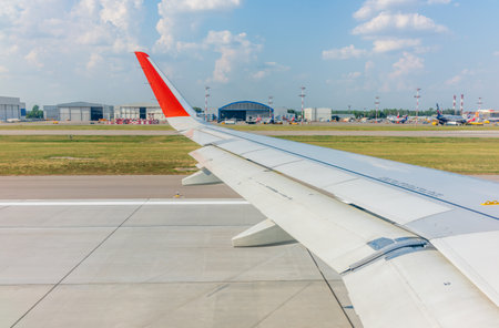 View from the airplane window during takeoff at Sheremetyevo airport at summer. Moscow, Russiaの写真素材
