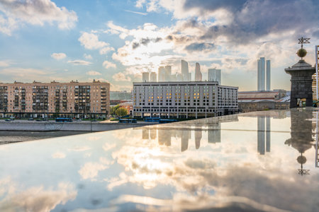 View of Berezhkovskaya Embankment in Moscow with reflection on a mirror stone surface. Moscow, Russiaの写真素材