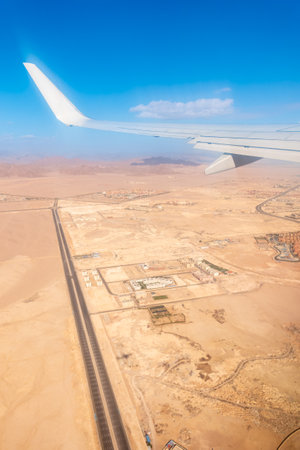 View from the airplane window during takeoff in Sharm el-Sheikh, Egypt. View from the airplane to desert mountainsの写真素材