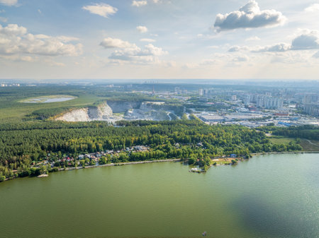 Flying over the summer mixed forest during sunset. The surroundings of Yekaterinburg. Ural, Russia, Aerial Viewの写真素材
