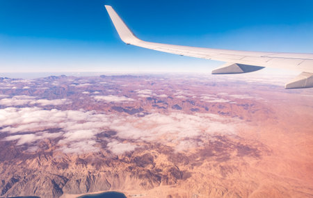 Aerial view on Arabian desert and Red sea mountains from airplane. View from the airplane desert mountainsの写真素材