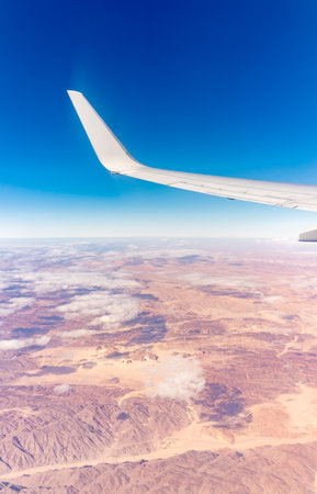 Aerial view on Arabian desert and Red sea mountains from airplane. View from the airplane desert mountainsの写真素材