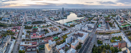 Yekaterinburg city and pond aerial panoramic view at summer sunset. View from the observation deck on the 52nd floor of Vysotsky skyscraper. Yekaterinburg, Russiaの写真素材