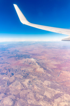 Aerial view on desert and mountains from airplane. View from the airplane desert mountainsの写真素材