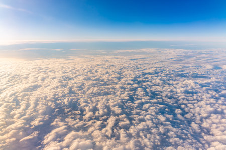 Beautiful sunrise over the clouds. View of the dawn in the clouds from the plane.の写真素材