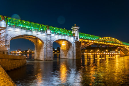Pushkinskiy bridge with night illumination. Pedestrian bridge with night illumination. Bridge to Gorky Park. Embankment of the Moscow Riverの写真素材