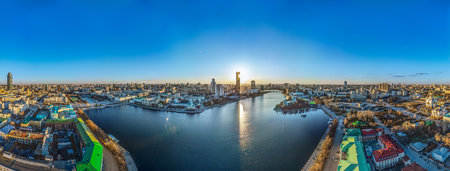 Yekaterinburg aerial panoramic view in spring at sunset. Yekaterinburg city and pond in spring or...