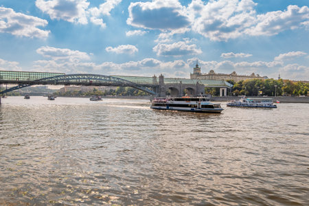 View of the Moscow river embankment, Pushkinsky bridge and cruise ships at sunset. Wide Moskva River, Pushkinsky bridge, Groky Park, Frunzenskaya embankment,の写真素材