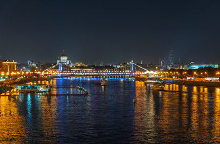 Krymsky Bridge or Crimean Bridge in Moscow at summer night. Steel suspension bridge in Moscow over the Moskva Riverの写真素材