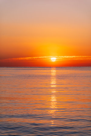 Beautiful red and orange sunrise over the sea. Beautiful seascape scenery, Amazing light of nature sunset backgroundの写真素材