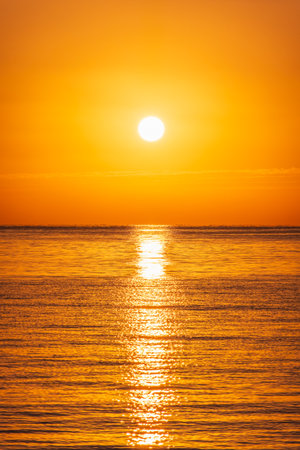 Beautiful red and orange sunrise over the sea. Beautiful seascape scenery, Amazing light of nature sunset backgroundの写真素材
