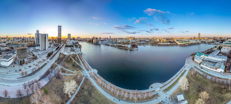 Yekaterinburg aerial panoramic view in spring at sunset. Yekaterinburg city and pond in spring or...