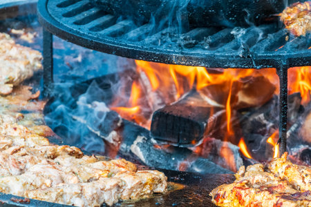 Steak on the grill with flames. Beef kababs on the grill closeup