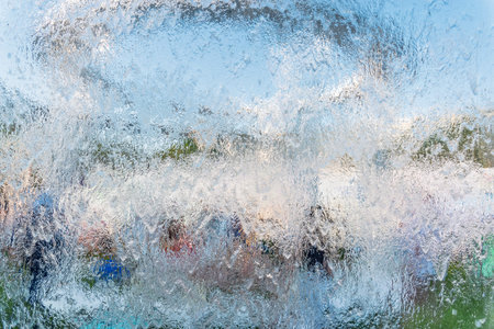 Aqua background. Product space next to clean water streams and water splashes and drops. water...