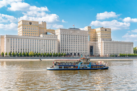 Moscow, Russia - August 06, 2023: View of the Ministry of Defense of Russian Federation, and Moscow river embankment with cruise ships. Translation - Ministry of Defense of the Russian Federationのeditorial素材